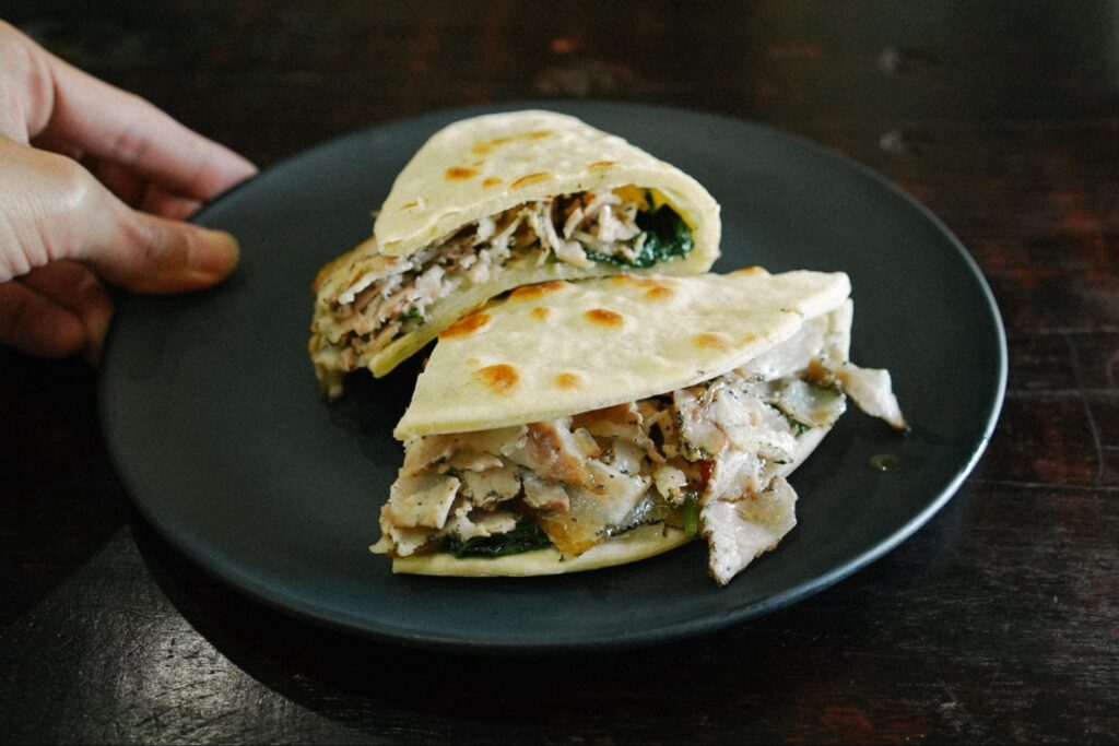 Authentic Italian Piadina with porchetta, cheese and seasonal vegetables